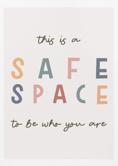 A framed poster with an inspirational message that reads 'this is a SAFE SPACE to be who you are'. The words 'SAFE SPACE' are in large, block letters of various muted colors like orange, sage, pink, and blue, while the rest of the text is in a smaller, dark green script font on an off-white background. Poster