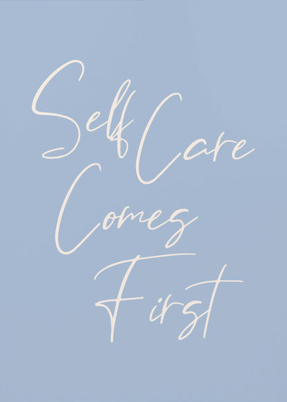 A framed poster featuring the phrase 'Self Care Comes First' in an elegant, off-white cursive font against a solid light blue background. The artwork is enclosed in a simple black frame. Decor