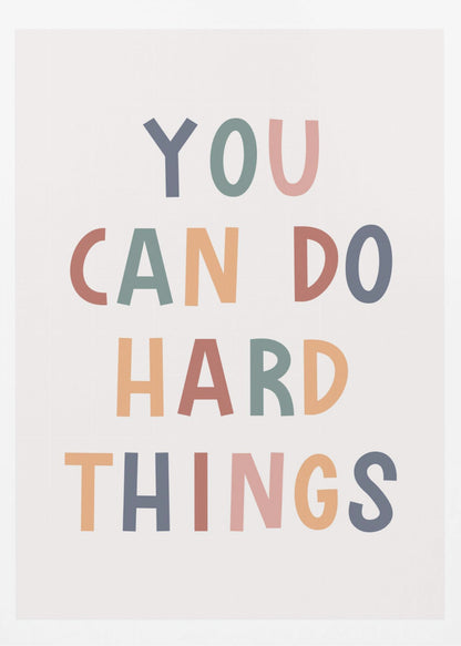 A framed poster featuring the inspirational quote 'YOU CAN DO HARD THINGS'. The text is in a simple, uppercase, sans-serif font with each letter in a different muted color, including shades of blue, green, pink, and orange, on a clean white background. Print
