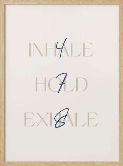 A minimalist framed art print with a cream background. It features the words 'INHALE', 'HOLD', and 'EXHALE' stacked vertically in a light beige serif font. Superimposed over these words are the numbers '4', '7', and '8' respectively, written in a dark blue cursive script, referencing the 4-7-8 breathing technique for relaxation. Wall Art