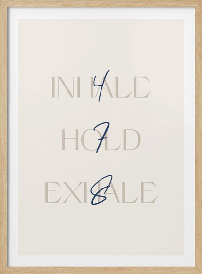 A minimalist framed art print with a cream background. It features the words 'INHALE', 'HOLD', and 'EXHALE' stacked vertically in a light beige serif font. Superimposed over these words are the numbers '4', '7', and '8' respectively, written in a dark blue cursive script, referencing the 4-7-8 breathing technique for relaxation. Wall Art