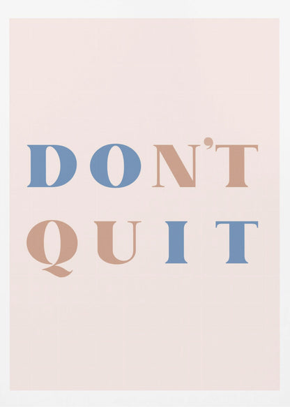 A minimalist motivational art print with a pale pink background and a thin black frame. The text reads 'DON'T QUIT' in a large serif font, with the words 'DO' and 'IT' highlighted in blue and the words 'N'T' and 'QU' in a muted terracotta color, creating a hidden 'DO IT' message. Decor