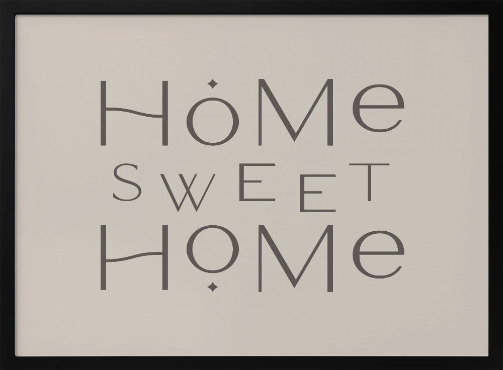 A minimalist wall art piece with the words 'Home Sweet Home' in a dark gray, stylized sans-serif font against a light beige background, all housed within a simple silver frame. Decor