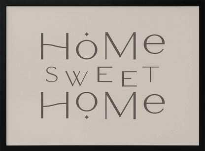 A minimalist wall art piece with the words 'Home Sweet Home' in a dark gray, stylized sans-serif font against a light beige background, all housed within a simple silver frame. Decor
