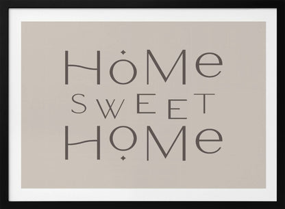 A minimalist wall art piece with the words 'Home Sweet Home' in a dark gray, stylized sans-serif font against a light beige background, all housed within a simple silver frame. Decor