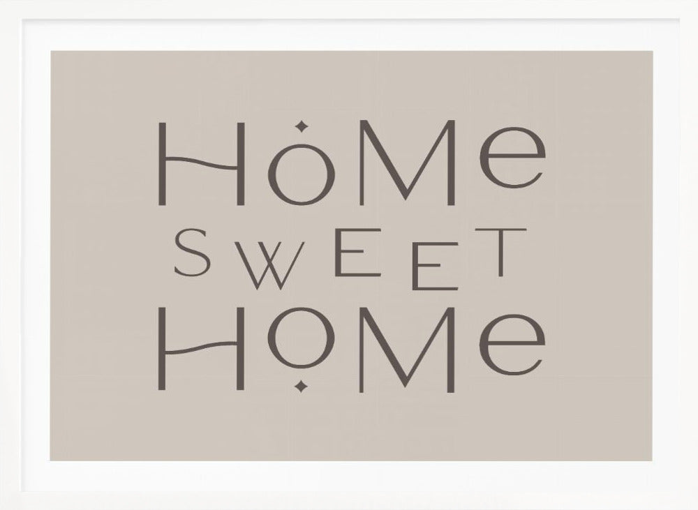 A minimalist wall art piece with the words 'Home Sweet Home' in a dark gray, stylized sans-serif font against a light beige background, all housed within a simple silver frame. Decor