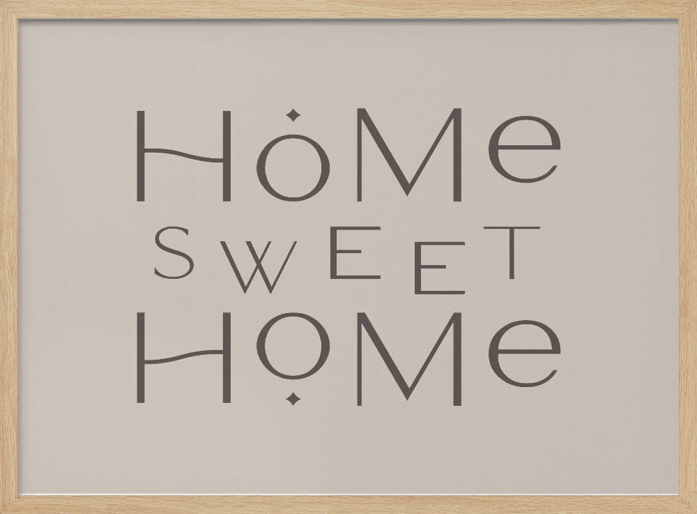 A minimalist wall art piece with the words 'Home Sweet Home' in a dark gray, stylized sans-serif font against a light beige background, all housed within a simple silver frame. Decor