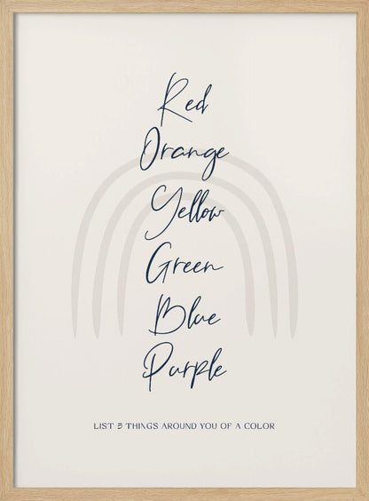 A minimalist art print in a black frame with a beige background. A faint, muted rainbow arch is in the background. In the foreground, the colors 'Red, Orange, Yellow, Green, Blue, Purple' are listed vertically in a dark blue cursive font. At the bottom, it reads 'LIST 5 THINGS AROUND YOU OF A COLOR'. Wall Art