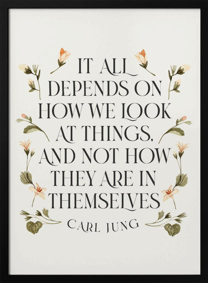 A framed art print featuring an inspirational quote by Carl Jung. The text reads 'It all depends on how we look at things, and not how they are in themselves' in a black serif font against an off-white background. The quote is encircled by a delicate wreath of watercolor botanicals with green leaves and pale orange flowers. Poster
