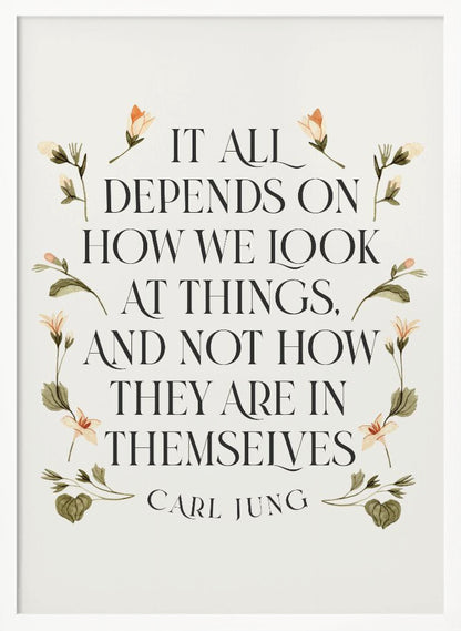 A framed art print featuring an inspirational quote by Carl Jung. The text reads 'It all depends on how we look at things, and not how they are in themselves' in a black serif font against an off-white background. The quote is encircled by a delicate wreath of watercolor botanicals with green leaves and pale orange flowers. Poster