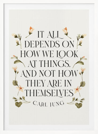 A framed art print featuring an inspirational quote by Carl Jung. The text reads 'It all depends on how we look at things, and not how they are in themselves' in a black serif font against an off-white background. The quote is encircled by a delicate wreath of watercolor botanicals with green leaves and pale orange flowers. Poster