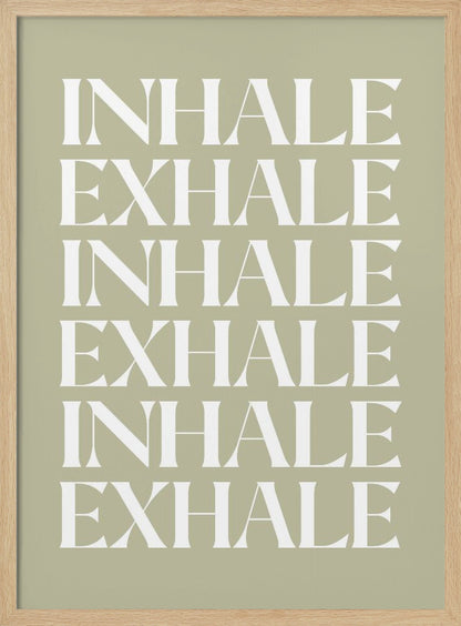 A minimalist art print featuring the words 'INHALE' and 'EXHALE' repeated in a vertical column. The text is in a bold, white serif font against a calming sage green background, all enclosed in a simple black frame. Print