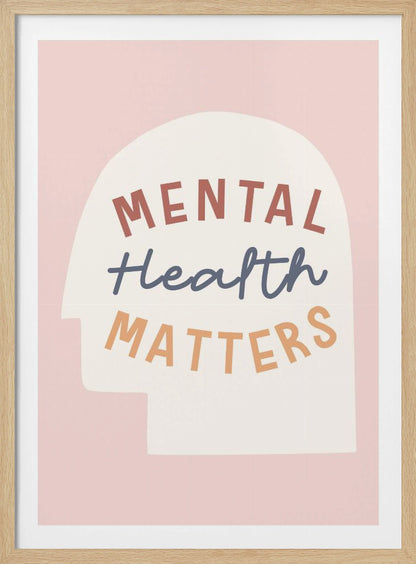 An inspirational art print with a light pink background featuring a cream-colored silhouette of a human head. Inside the silhouette, the phrase 'MENTAL Health MATTERS' is written in three different colors and fonts: rust red, slate blue script, and light orange. Wall Art