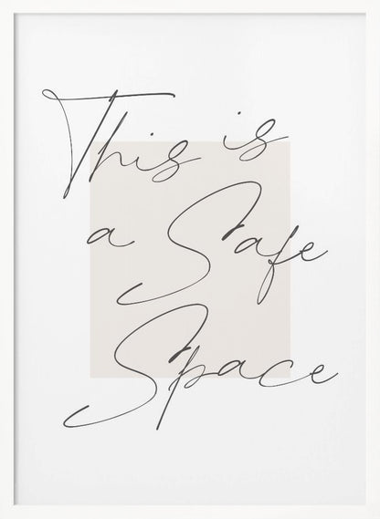 A minimalist art print in a black frame with the words 'This is a Safe Space' written in a flowing black cursive script over a pale beige rectangle on a white background. Artwork