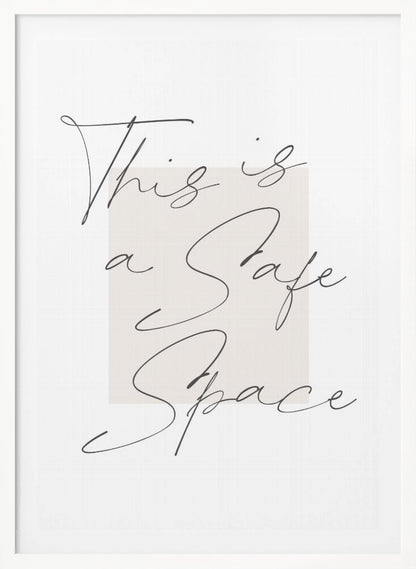 A minimalist art print in a black frame with the words 'This is a Safe Space' written in a flowing black cursive script over a pale beige rectangle on a white background. Artwork