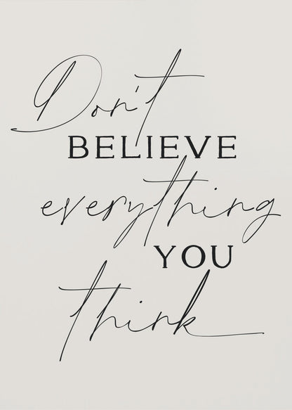 A minimalist art print with a thin black frame, featuring the quote 'Don't believe everything you think' in a mix of elegant script and serif fonts on a light beige background. Wall Art