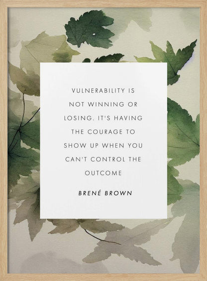 A framed art print featuring an inspirational quote by Brené Brown. The quote, 'Vulnerability is not winning or losing. It's having the courage to show up when you can't control the outcome,' is printed in black uppercase letters on a central white rectangle. The background consists of a soft watercolor illustration of green and beige leaves. The piece is enclosed in a simple black frame. Wall Art