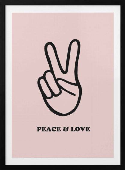 A minimalist art print with a light pink background featuring a bold black outline of a hand making a peace sign. Below the hand, the words 'PEACE & LOVE' are printed in a black serif font. The print is enclosed in a simple black frame. Print