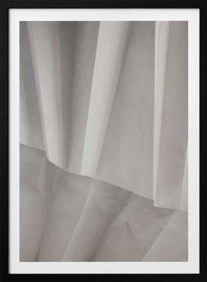 Abstract art print of folded white fabric or paper creating soft lines and deep shadows.