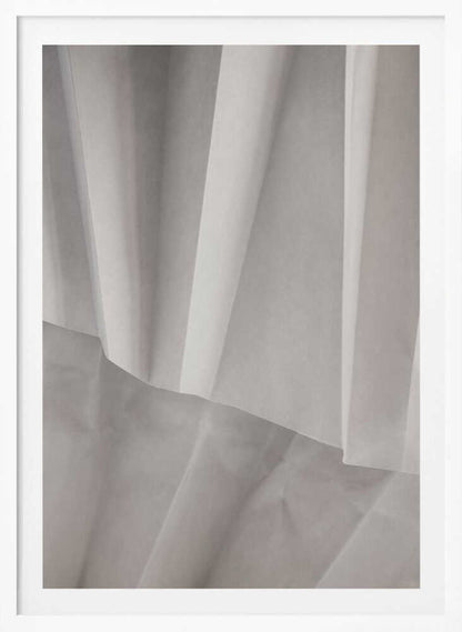Abstract art print of folded white fabric or paper creating soft lines and deep shadows.