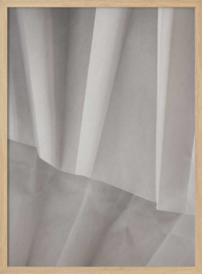 Abstract art print of folded white fabric or paper creating soft lines and deep shadows.