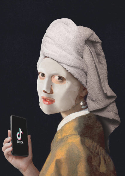 A humorous modern parody of Vermeer's 'Girl with a Pearl Earring,' where the subject wears a white clay face mask and a towel wrapped around her head, looking over her shoulder while holding a smartphone displaying the TikTok app. Decor