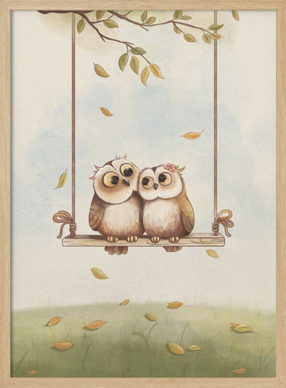 A charming vertical illustration of two cute cartoon owls, a couple, sitting together on a wooden swing hanging from a tree branch. Autumn leaves fall around them against a soft sky and a green grassy field. Artwork