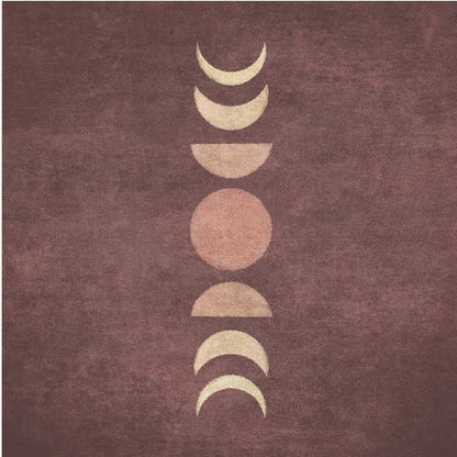 A minimalist piece of framed art showing the phases of the moon arranged vertically against a textured, deep maroon background. The moon shapes are colored in shades of cream and dusty rose, with the full moon in the center. Print