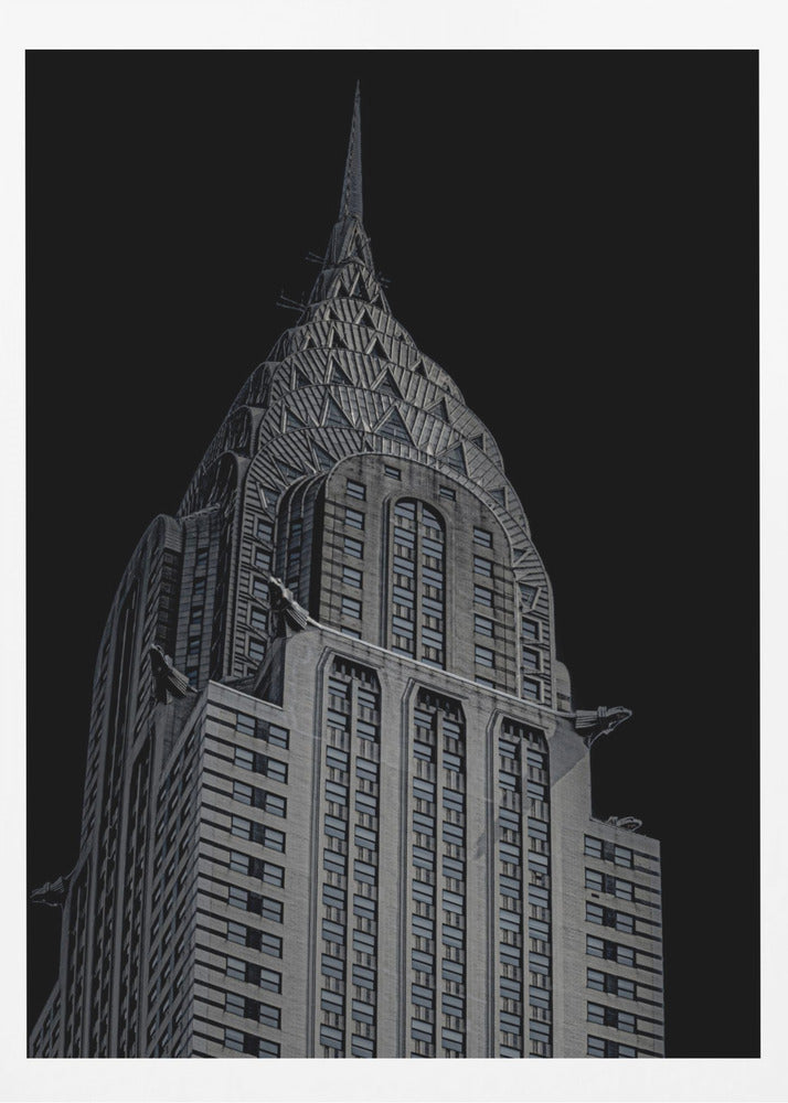 A dramatic, low-angle, black and white photograph of the top of the Chrysler Building, showcasing its iconic Art Deco spire and architectural details against a solid black background. Decor
