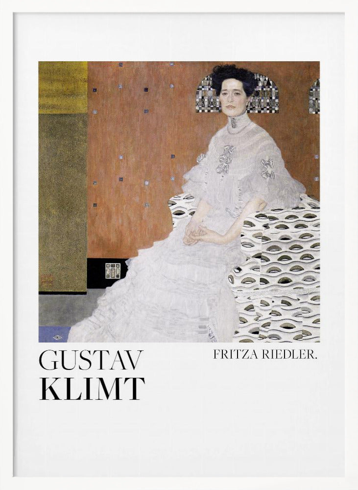 A framed art print of Gustav Klimt's 1906 painting, 'Portrait of Fritza Riedler'. A woman with dark, upswept hair wearing a detailed, high-necked white gown sits in a patterned chair against a warm, textured brown and gold background. Below the artwork, on a white border, the text 'GUSTAV KLIMT' and 'FRITZA RIEDLER.' is printed. Print