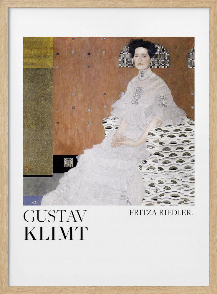 A framed art print of Gustav Klimt's 1906 painting, 'Portrait of Fritza Riedler'. A woman with dark, upswept hair wearing a detailed, high-necked white gown sits in a patterned chair against a warm, textured brown and gold background. Below the artwork, on a white border, the text 'GUSTAV KLIMT' and 'FRITZA RIEDLER.' is printed. Print