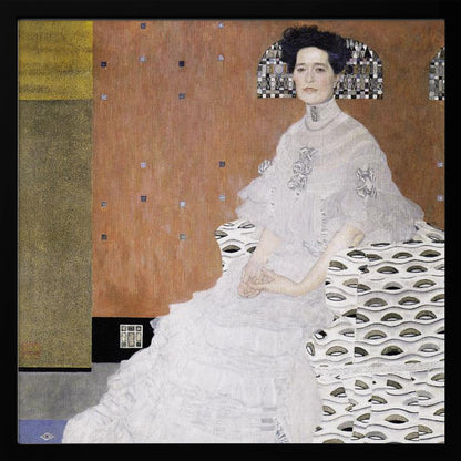 A framed print of Gustav Klimt's 'Portrait of Fritza Riedler'. A woman with dark upswept hair wearing a flowing white gown sits in a patterned armchair against a geometric, earth-toned background. Decor