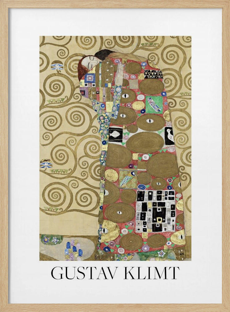 A framed art print of Gustav Klimt's painting 'Fulfillment,' featuring a stylized couple embracing. They are enveloped in ornate, patterned robes with geometric and circular motifs, set against a golden background with swirling patterns. The artist's name, 'GUSTAV KLIMT,' is printed below the image. Wall Art
