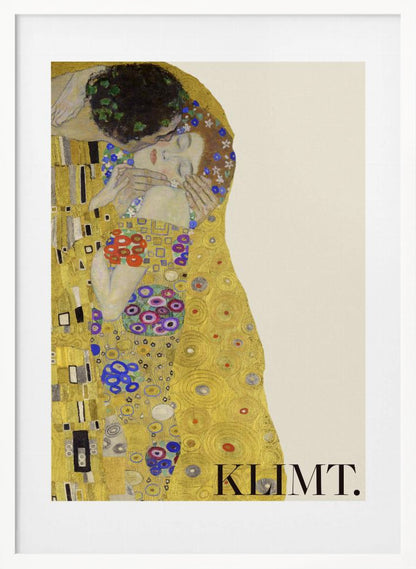 A framed art print of Gustav Klimt's 'The Kiss'. A couple embraces in ornate golden robes against a shimmering gold background. The poster includes the artist's name 'KLIMT.' in the lower right. Decor