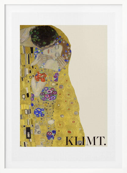 A framed art print of Gustav Klimt's 'The Kiss'. A couple embraces in ornate golden robes against a shimmering gold background. The poster includes the artist's name 'KLIMT.' in the lower right. Decor