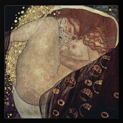 A print of Gustav Klimt's 1907 painting, 'Danaë'. The artwork depicts a sleeping, nude woman with vibrant red hair curled into a fetal position, receiving a shower of golden rain. The style is characteristic of Art Nouveau, with rich, decorative patterns on surrounding fabrics against a dark, star-like background, all within a light wood frame. Wall Art
