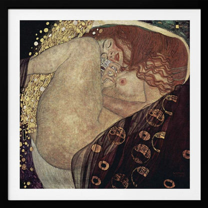 A print of Gustav Klimt's 1907 painting, 'Danaë'. The artwork depicts a sleeping, nude woman with vibrant red hair curled into a fetal position, receiving a shower of golden rain. The style is characteristic of Art Nouveau, with rich, decorative patterns on surrounding fabrics against a dark, star-like background, all within a light wood frame. Wall Art