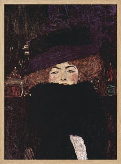 A classic portrait painting by Gustav Klimt of a woman with auburn hair wearing a large purple hat. A voluminous black fur boa covers the lower half of her face, with only her eyes, nose, and rosy cheeks visible as she stares directly at the viewer against a dark, moody background. Decor
