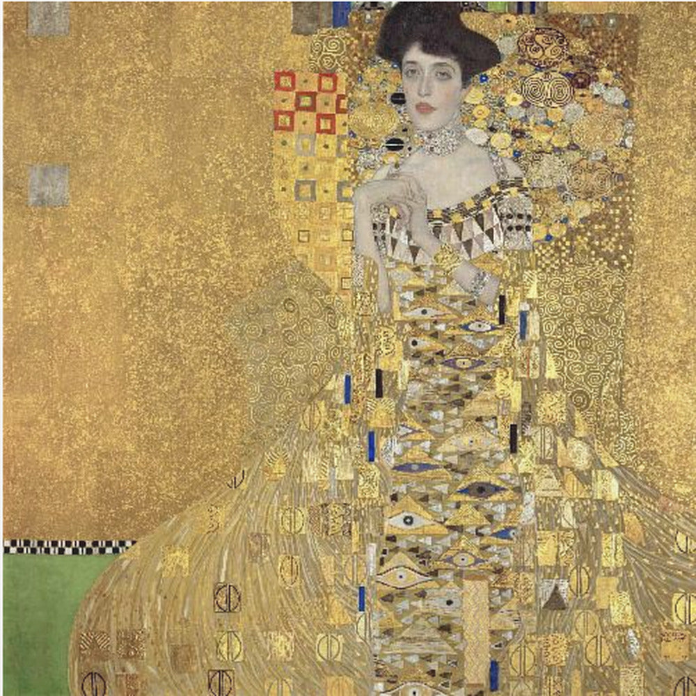 A framed print of Gustav Klimt's 'Portrait of Adele Bloch-Bauer I,' also known as 'The Woman in Gold.' The painting depicts a woman in an ornate, gilded gown covered in intricate patterns, blending into a shimmering gold background characteristic of the Art Nouveau style. Poster