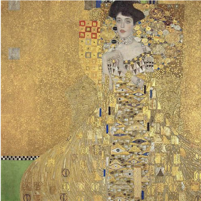 A framed print of Gustav Klimt's 'Portrait of Adele Bloch-Bauer I,' also known as 'The Woman in Gold.' The painting depicts a woman in an ornate, gilded gown covered in intricate patterns, blending into a shimmering gold background characteristic of the Art Nouveau style. Poster