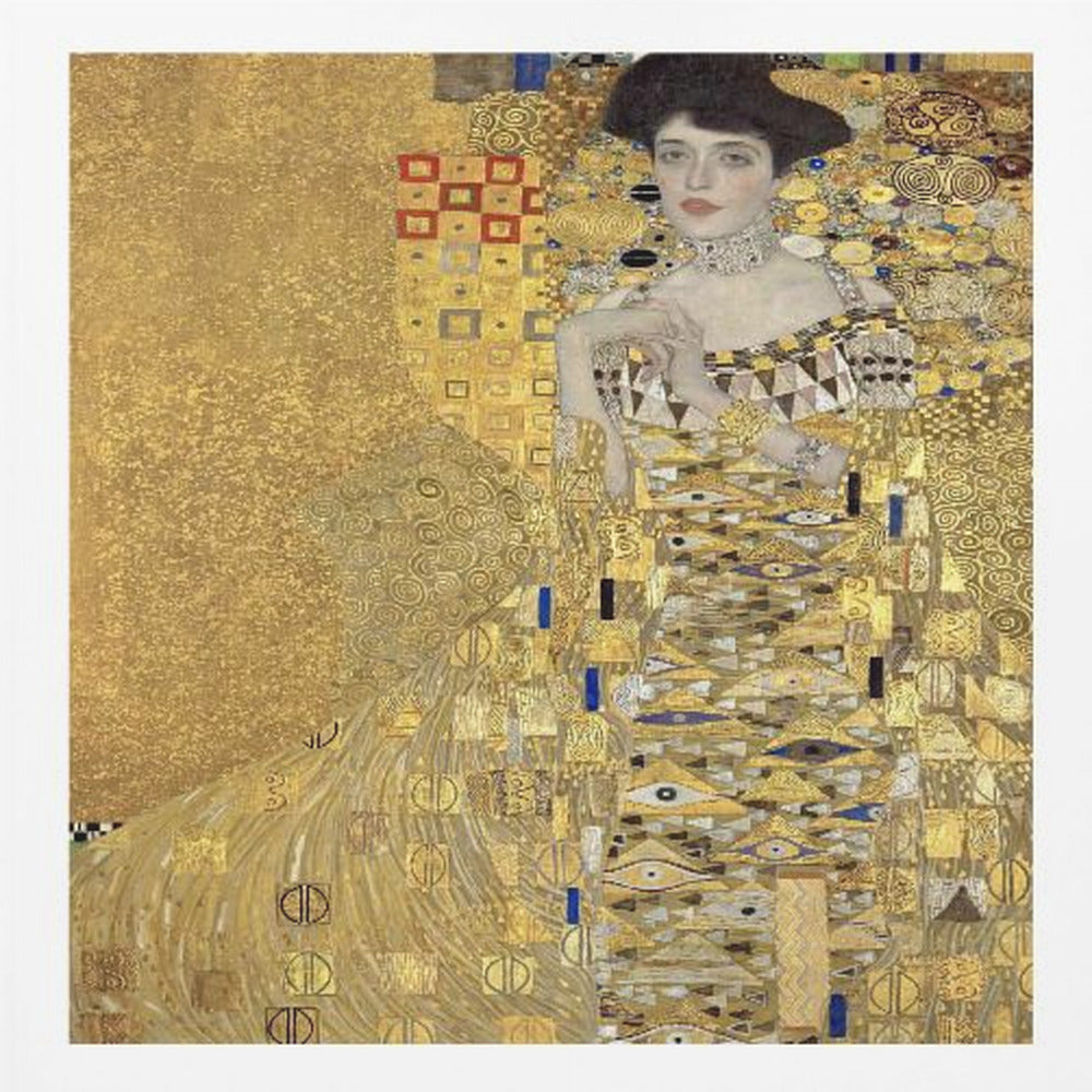 A framed print of Gustav Klimt's 'Portrait of Adele Bloch-Bauer I,' also known as 'The Woman in Gold.' The painting depicts a woman in an ornate, gilded gown covered in intricate patterns, blending into a shimmering gold background characteristic of the Art Nouveau style. Poster