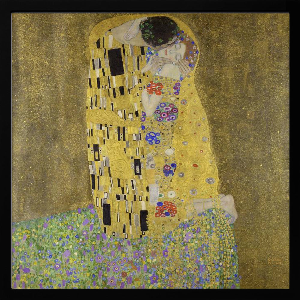 A framed print of Gustav Klimt's famous painting, 'The Kiss'. It features a couple in a passionate embrace, adorned in ornate, patterned golden robes. They are kneeling on a vibrant bed of flowers against a shimmering, textured gold background. Print