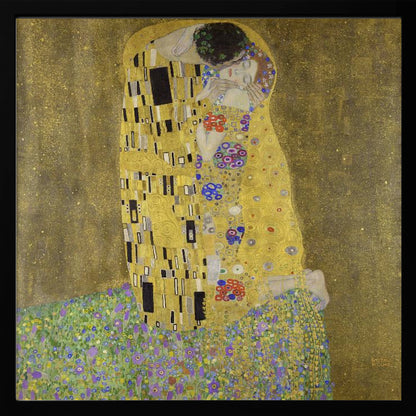 A framed print of Gustav Klimt's famous painting, 'The Kiss'. It features a couple in a passionate embrace, adorned in ornate, patterned golden robes. They are kneeling on a vibrant bed of flowers against a shimmering, textured gold background. Print