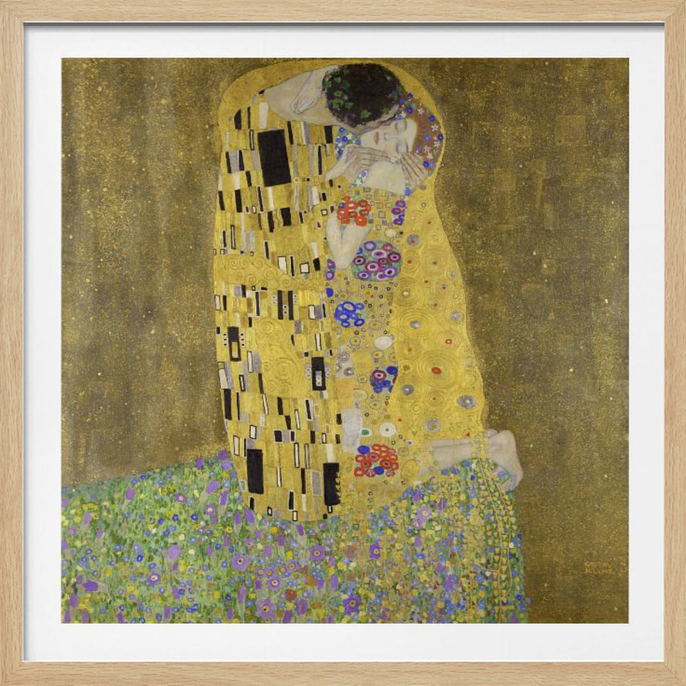 A framed print of Gustav Klimt's famous painting, 'The Kiss'. It features a couple in a passionate embrace, adorned in ornate, patterned golden robes. They are kneeling on a vibrant bed of flowers against a shimmering, textured gold background. Print