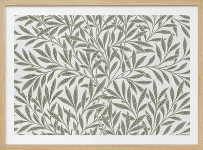 A framed art print displaying a dense pattern of sage green leaves and branches on a white background. The design is continuous and has a calm, naturalistic feel, enclosed within a simple silver frame. Artwork