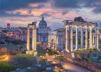 A scenic photograph of the ancient Roman Forum in Rome, Italy, at dusk. The ruins, including prominent columns and arches, are illuminated by warm lights, contrasting with the deep blue and vibrant pink of the sunset sky. Wall Art