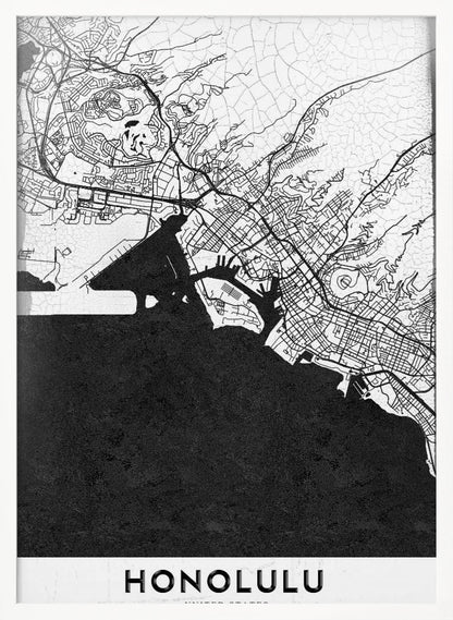 A framed, minimalist black and white map of Honolulu, Hawaii. The city's streets and coastline are rendered in black lines on a white background, while the ocean is a solid, textured black. The word 'HONOLULU' is printed in black sans-serif font at the bottom. Artwork