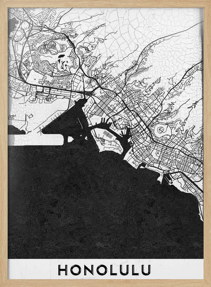 A framed, minimalist black and white map of Honolulu, Hawaii. The city's streets and coastline are rendered in black lines on a white background, while the ocean is a solid, textured black. The word 'HONOLULU' is printed in black sans-serif font at the bottom. Artwork