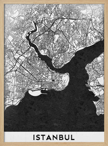A modern black and white framed poster of a city map of Istanbul. The land is depicted in white with intricate black lines representing streets, while the bodies of water like the Bosphorus are shown in solid textured black. A white banner at the bottom displays the word 'ISTANBUL' in a bold, black, sans-serif font. Artwork