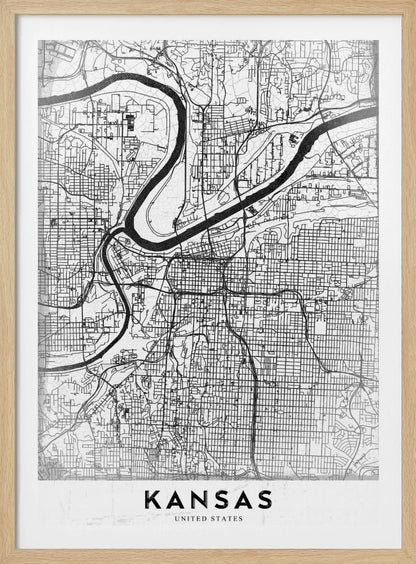 A modern, black and white line-art map of Kansas City, displayed in a black frame. The map details the intricate grid of streets and the winding path of a major river. At the bottom, a white border contains the word 'KANSAS' in bold, black capital letters. Artwork